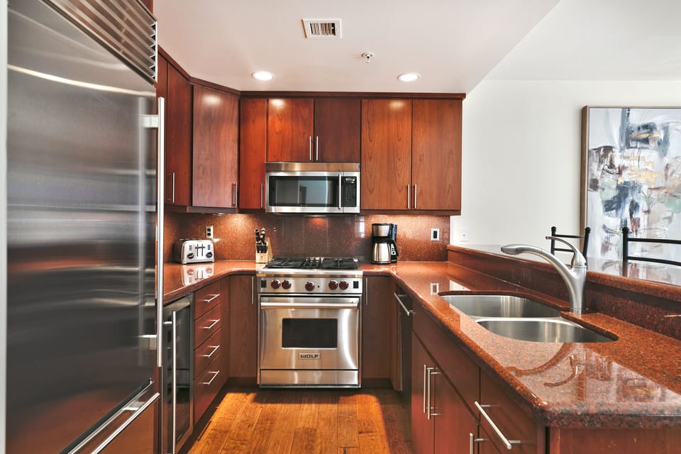 Chef's kitchen with gas stove, over range microwave, coffee maker and everything you need to cook or dine in
