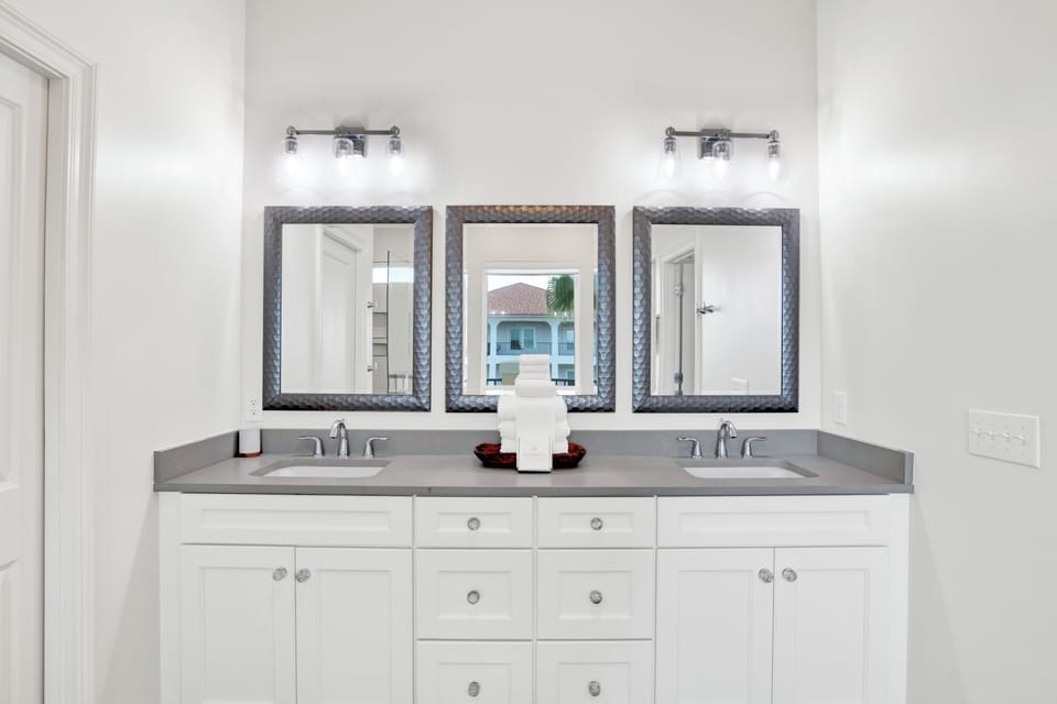 The primary bathroom has dual vanities