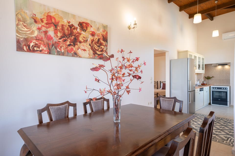 The dining room provides a wooden table, which sits up to 6 people.