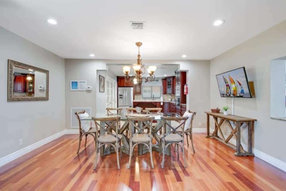 Open dining area seats 8 with easy access to kitchen.