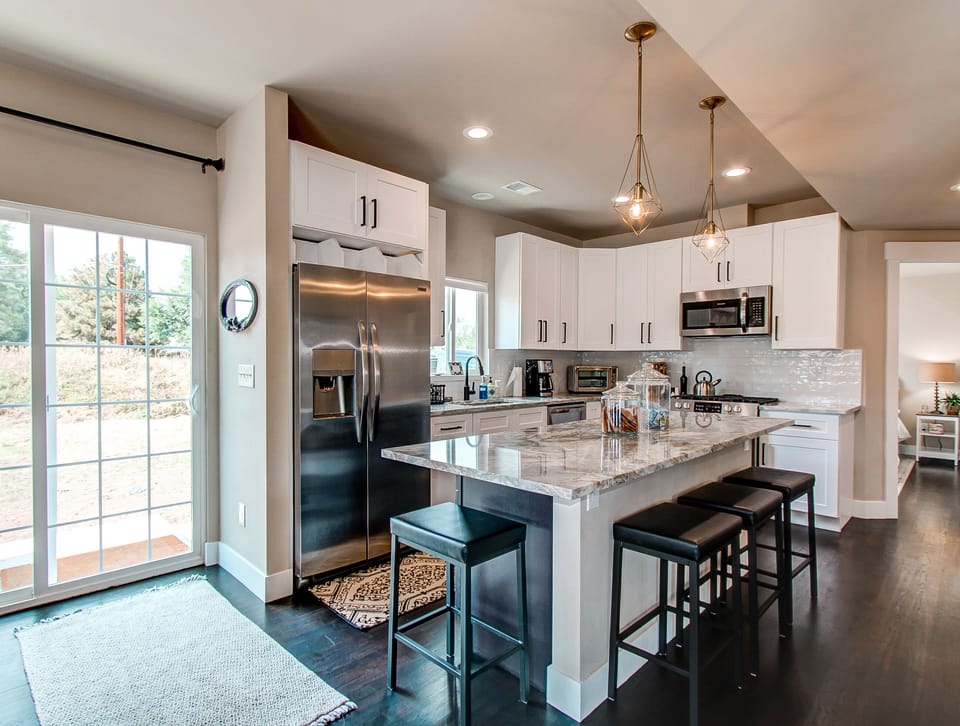 Large kitchen island with comfy bar stools