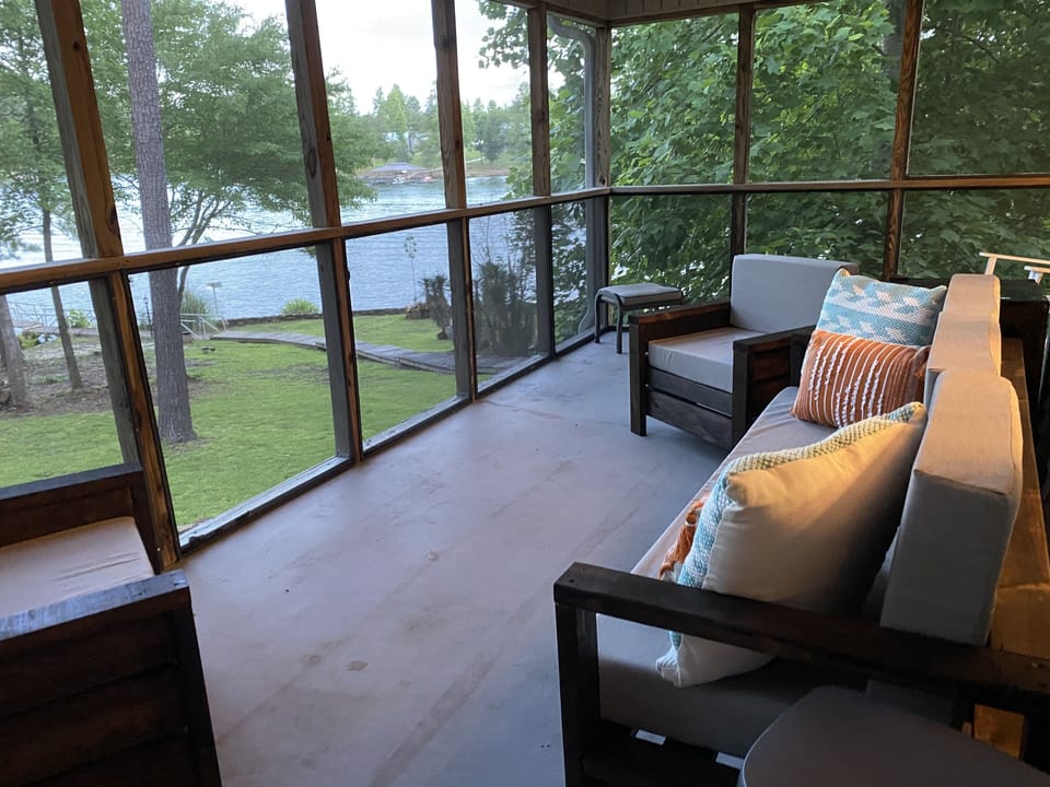 sitting area of screened in porch