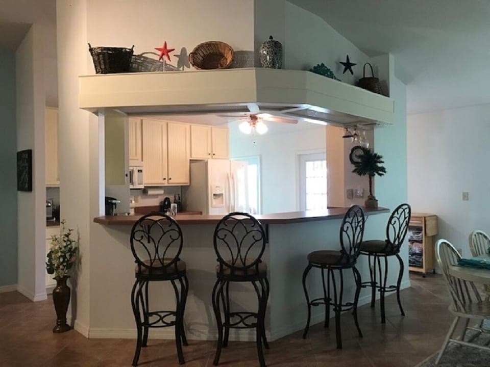 View into the kitchen/bar area from the living room
