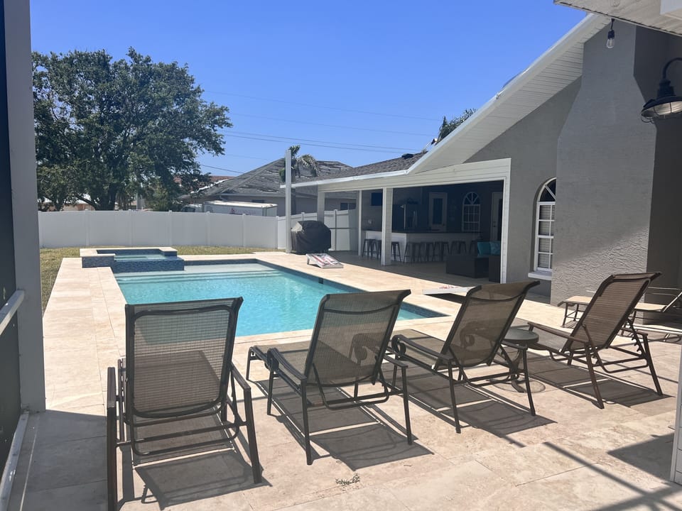 Fenced in backyard for privacy. Many lounge chairs!