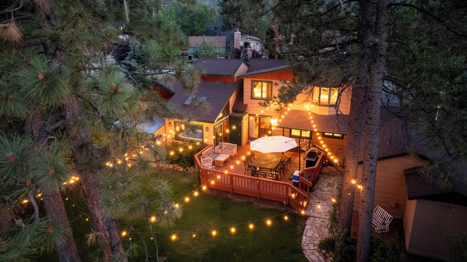 Backyard - Beautifully landscaped backyard with a great space for entertaining, lighting & more, with a peekaboo view of the lake.