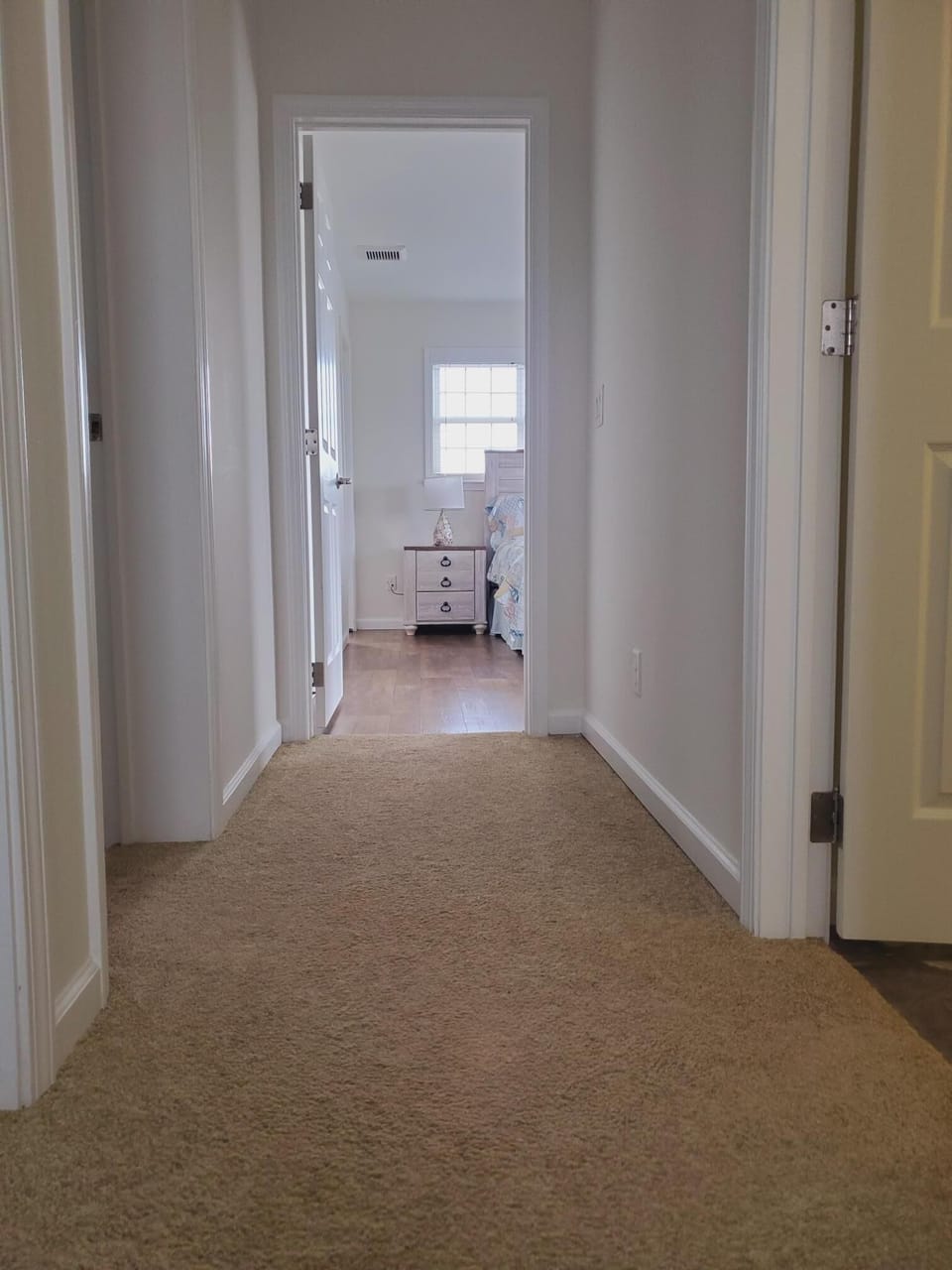 Hallway to 3 bedrooms and 2 bathrooms