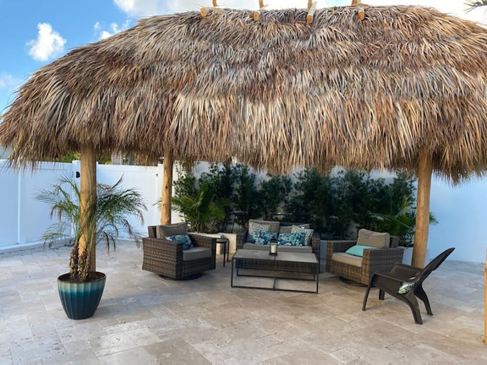 Tiki Hut in the back yard is a great place to take a break from the sun!