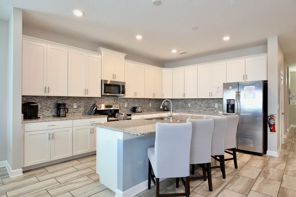 Modern kitchen with bar island seating. 