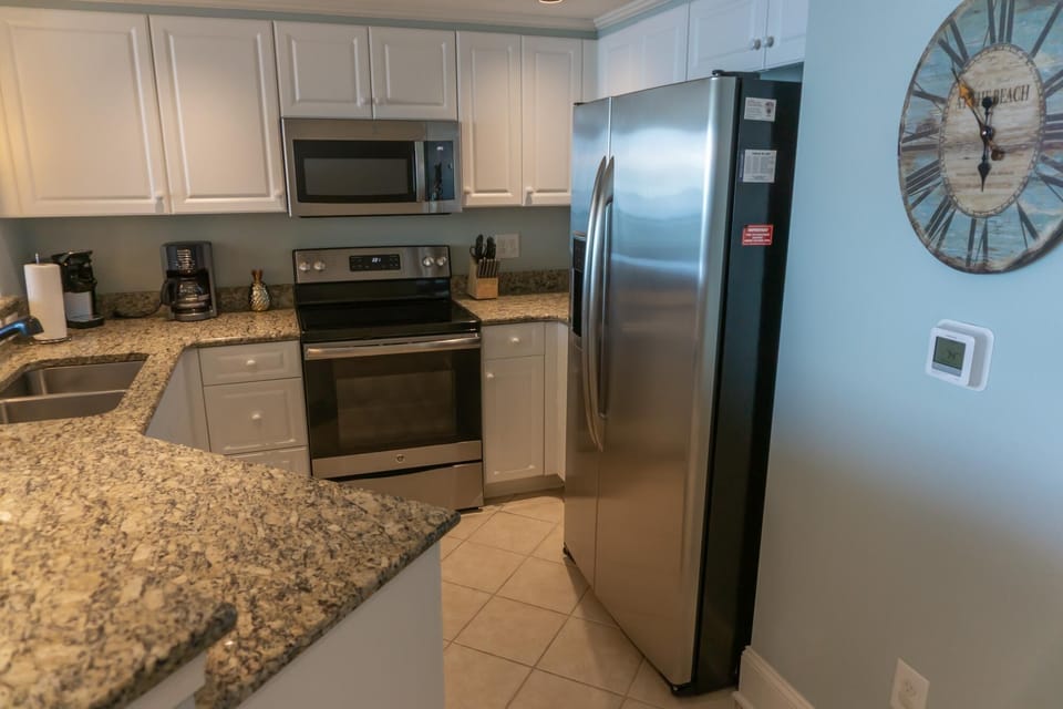Modern kitchen with granite countertops and stainless steel appliances