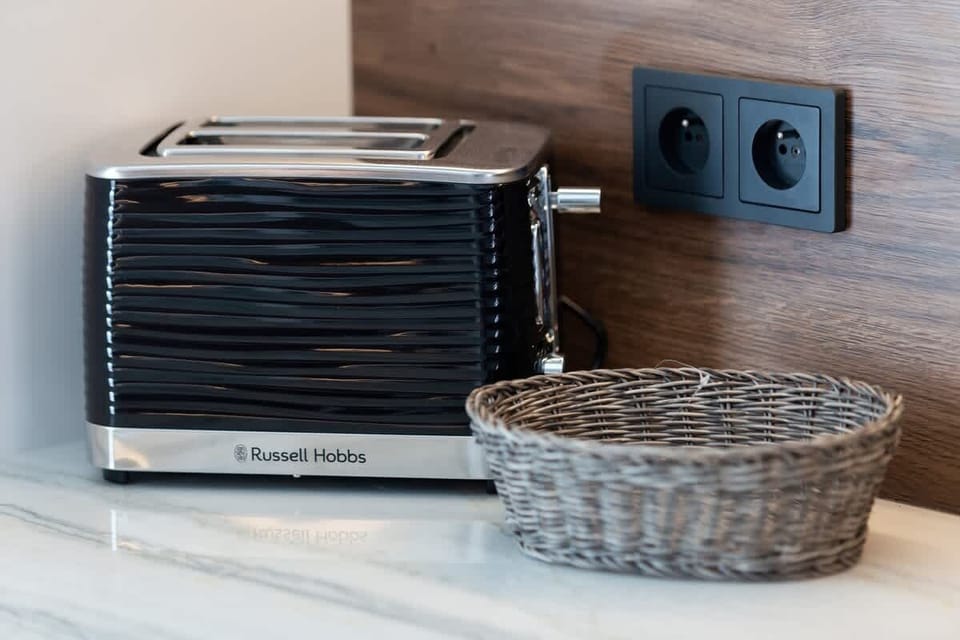 A close-up of the toaster located in the kitchenette, which is sure to come in handy in preparing a delicious breakfast.