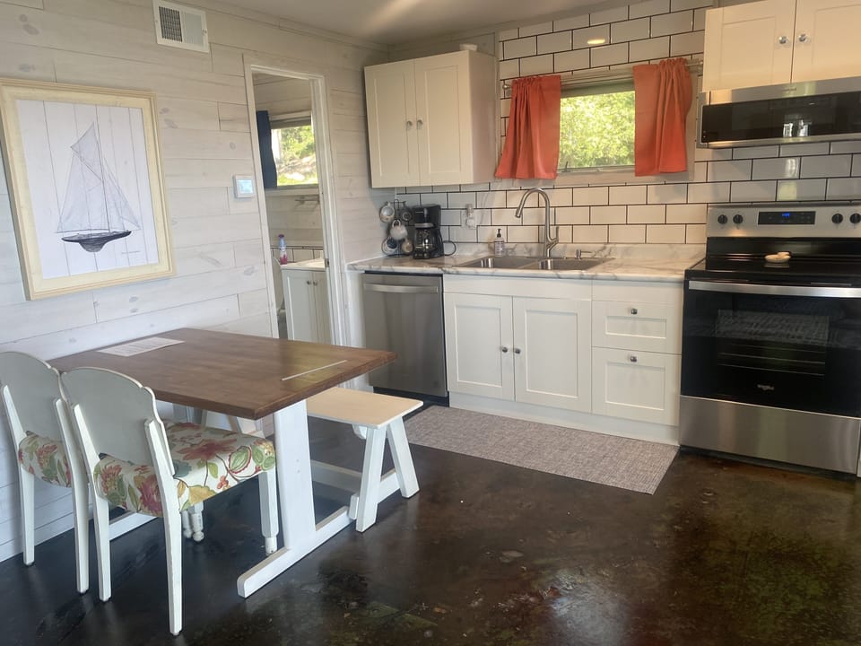 fully stocked kitchen and dining