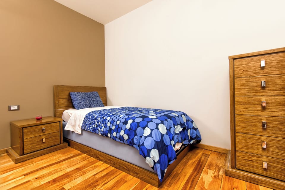A single bed located in one of the bedrooms at the 1st floor. 
