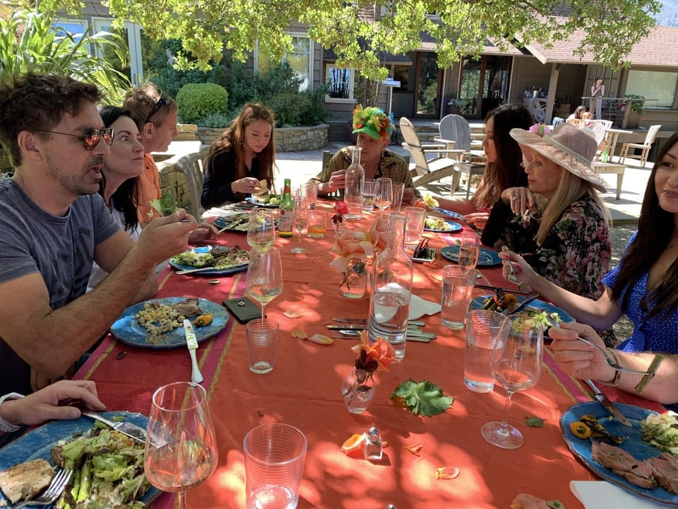 Outdoor kitchen and large teak dining table make the perfect place to entertain