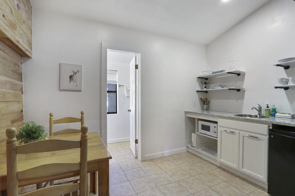 Newly remodeled kitchenette with a coffee bar, microwave, and minifridge