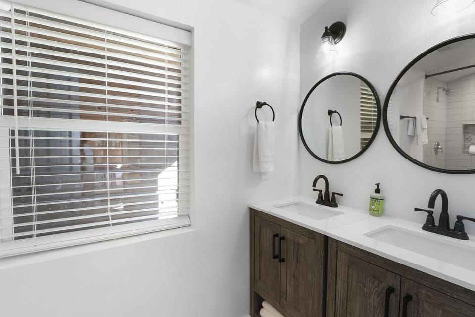 Full bathroom with dual vanities