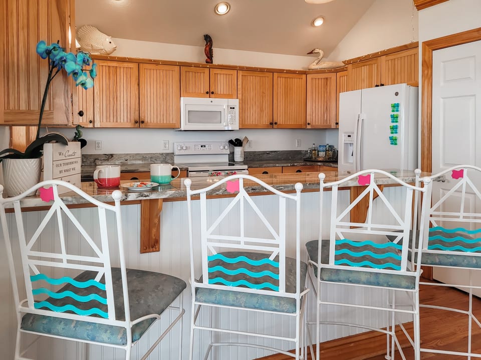 The kitchen is perfectly stocked and has its own ocean view!