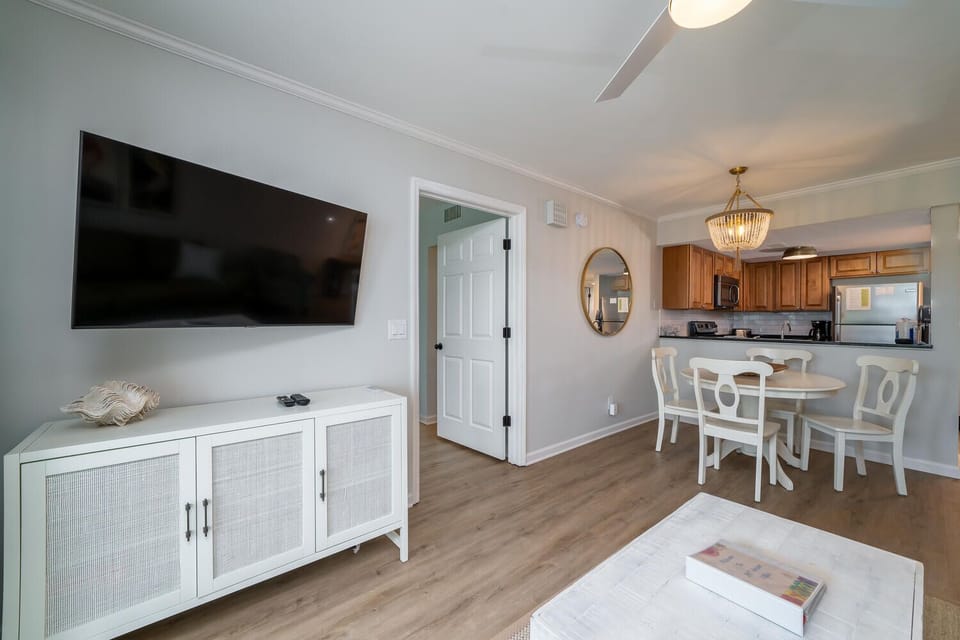 The floor plan is open and inviting. Kitchen looks onto dining room which flows into living area.