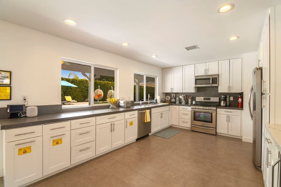 An enormous kitchen with plenty of space for multiple chefs to prepare meals.