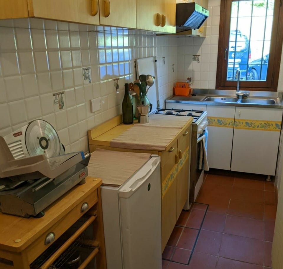 Room, Countertop, Property, Kitchen, Cabinetry, Furniture, Floor, Tile, Major Appliance, Building