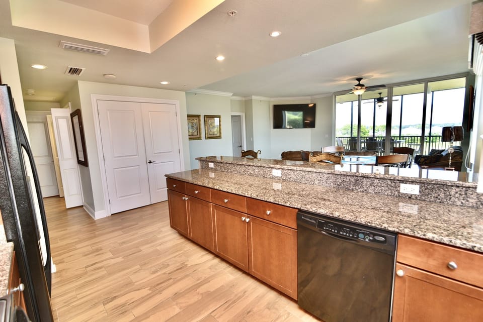 Kitchen to living room with 75” TV