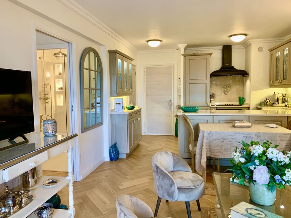 Air-conditioned living room - showing access to bedroom & ensuite shower room