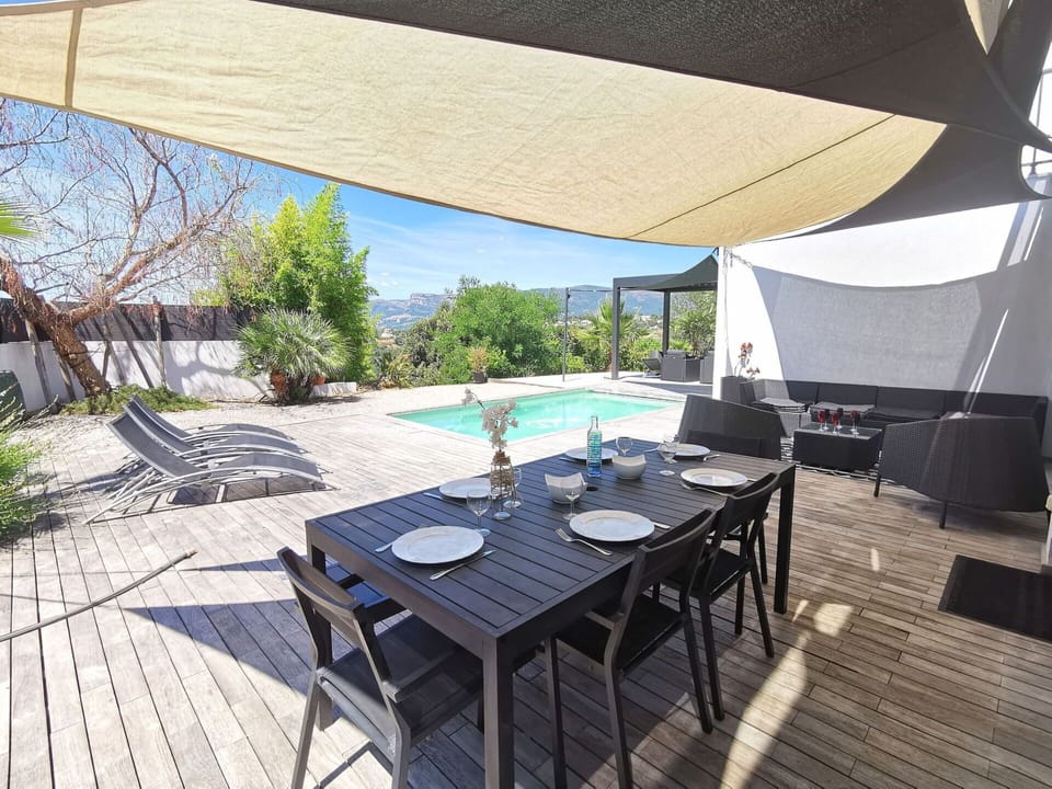 Table, Furniture, Property, Plant, Chair, Sky, Shade, Interior Design, Outdoor Furniture, Architecture