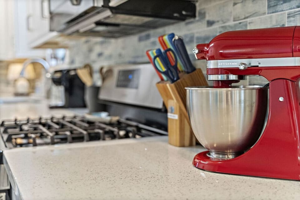 Strategically placed and thoughtfully provided amenities are scattered throughout The Blue Pelican. Including the A Stay Above The Rest signature staple - A Kitchen-Aid Stand Mixer.