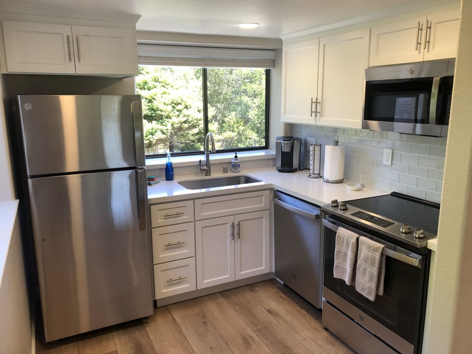 All new appliances, cabinets, counters and tile. 