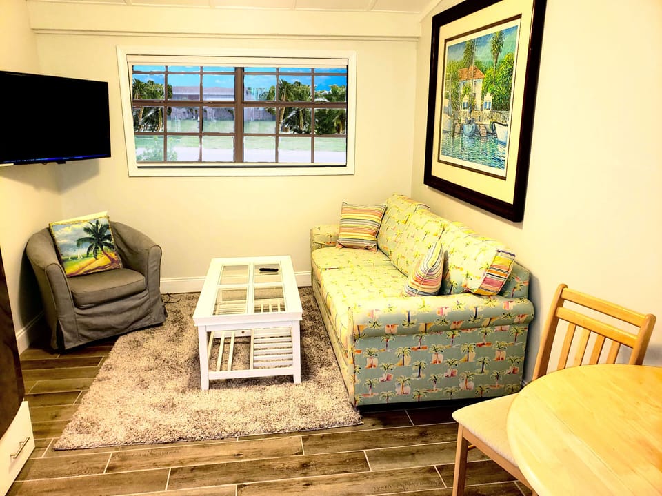 Comfortable living area with large screen smart TV