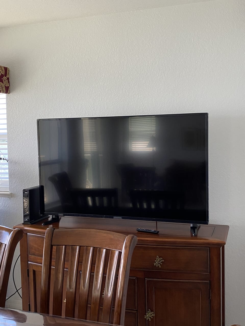 55 inch smart TV in living/ dining room