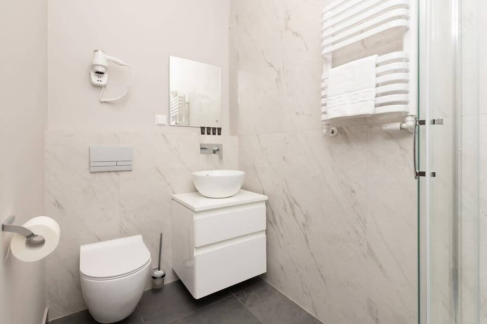 Practical and stylish, the bathroom is designed for comfort.