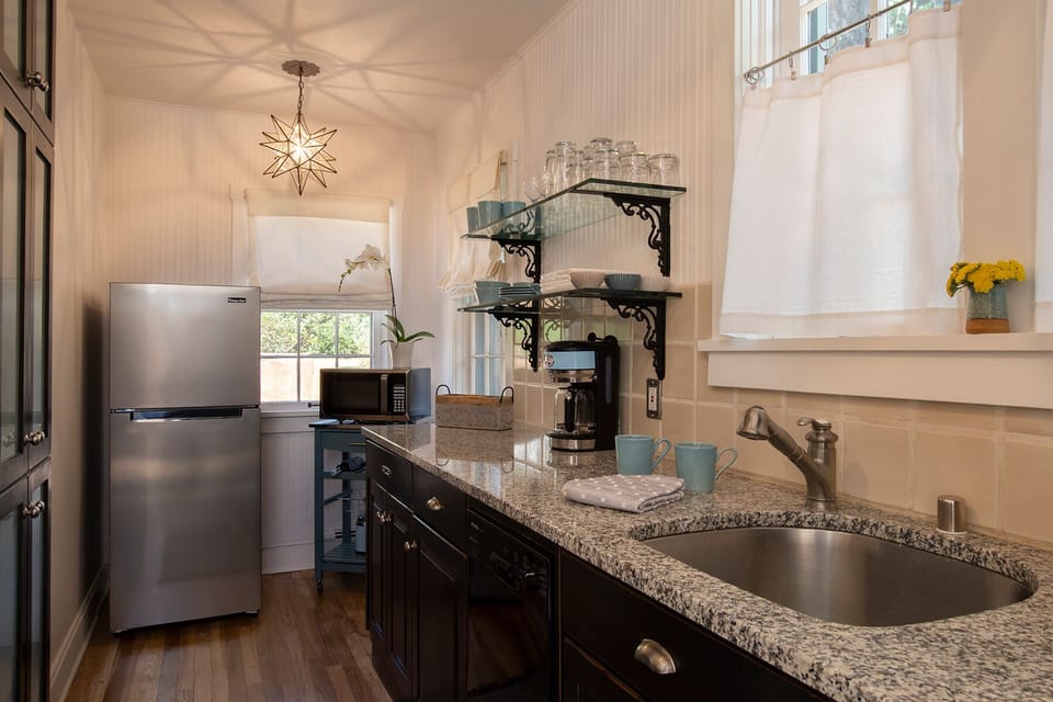 Fully stocked kitchen with door leading outside