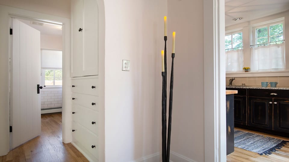 View of kitchen, hallway and bathroom