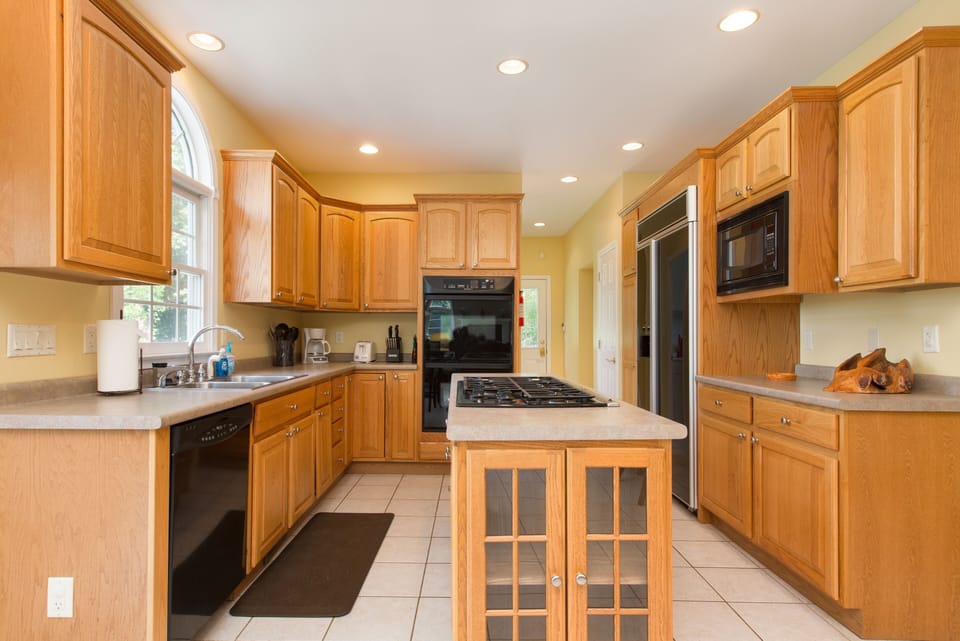 Full kitchen with plates, and pans if you decide to cook at home. 