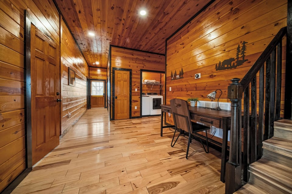 In the foyer, there is a work desk, W/D, 2 bedrooms on the left, and big bath.