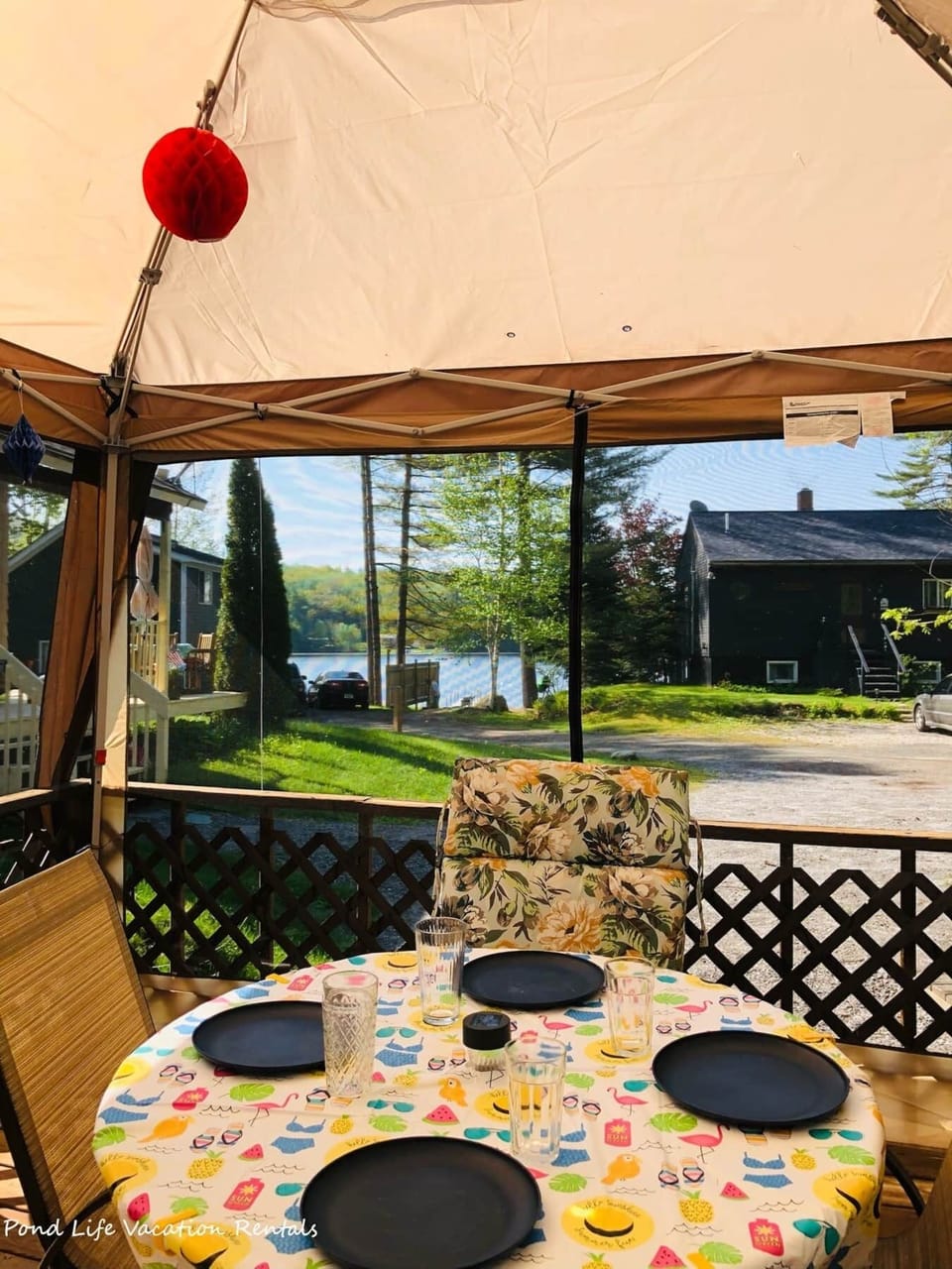 Outdoor sitting area under screened canopy. Limited water views.