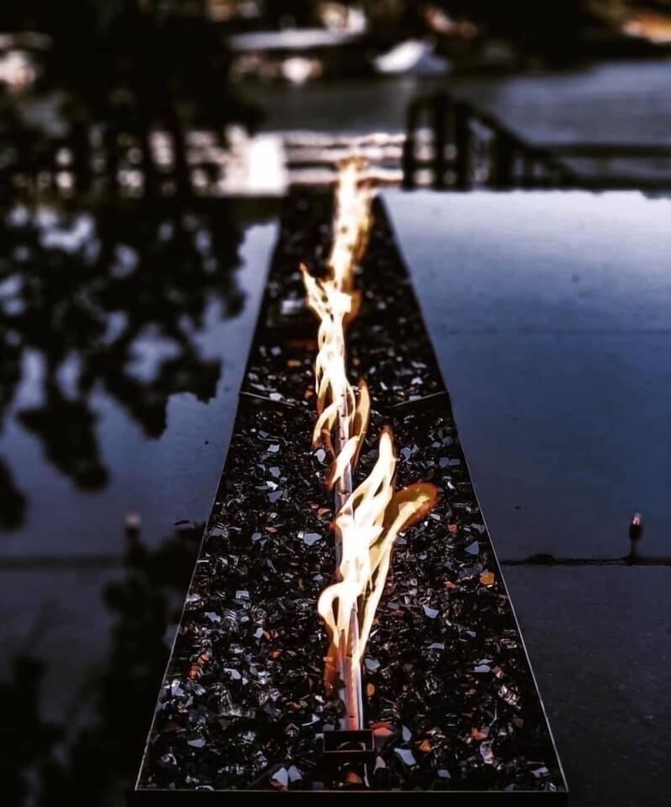 Come sit at our gorgeous fire table that over looks the water.