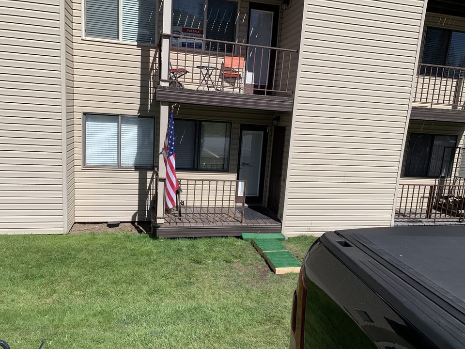 Park outside of the back door.