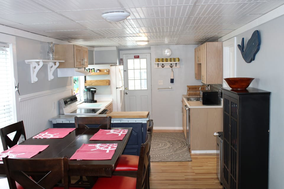 Open floor plan has a great breeze from rear screened door.