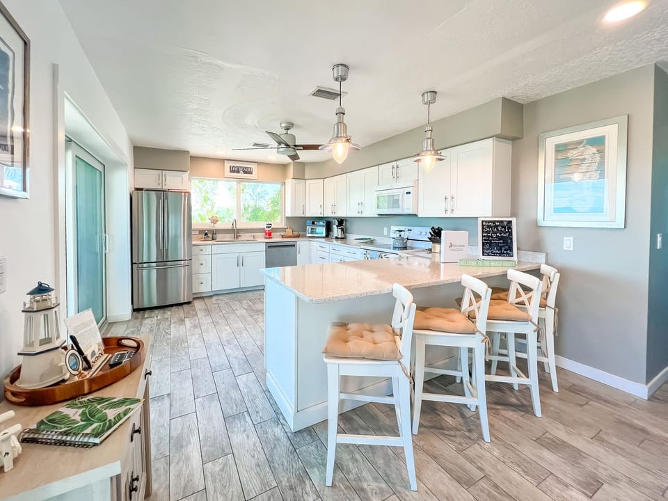 Island seating for 4 and slider to porch for outdoor dining.