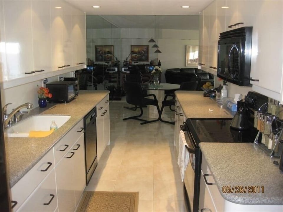View of Kitchen, Dining Area and Office Desk Beyond