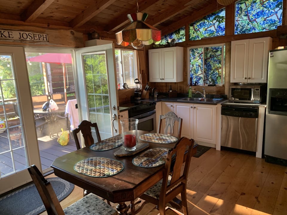 Kitchen Area with Double doors open out to Main Front deck so 2 Dining areas