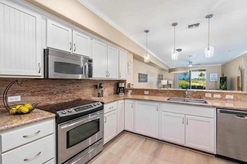 Fully equipped kitchen with granite counters and stainless steel appliances