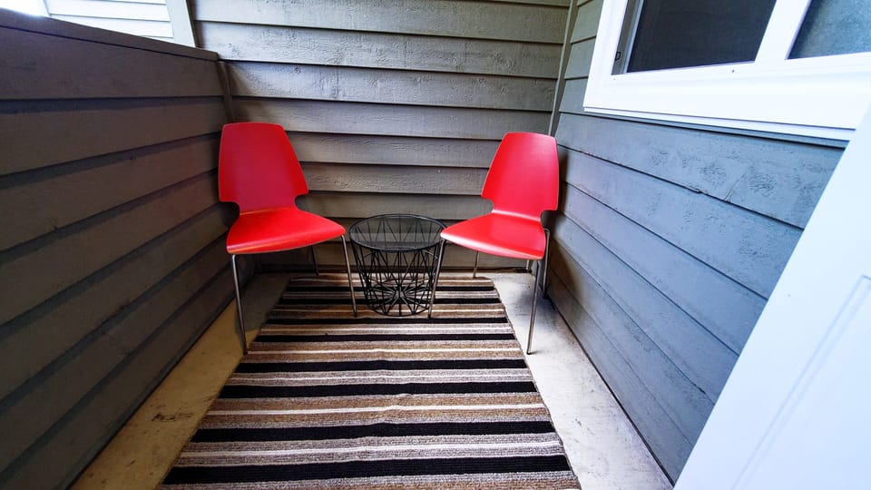 A small outdoor seating area is the perfect place to take in the views