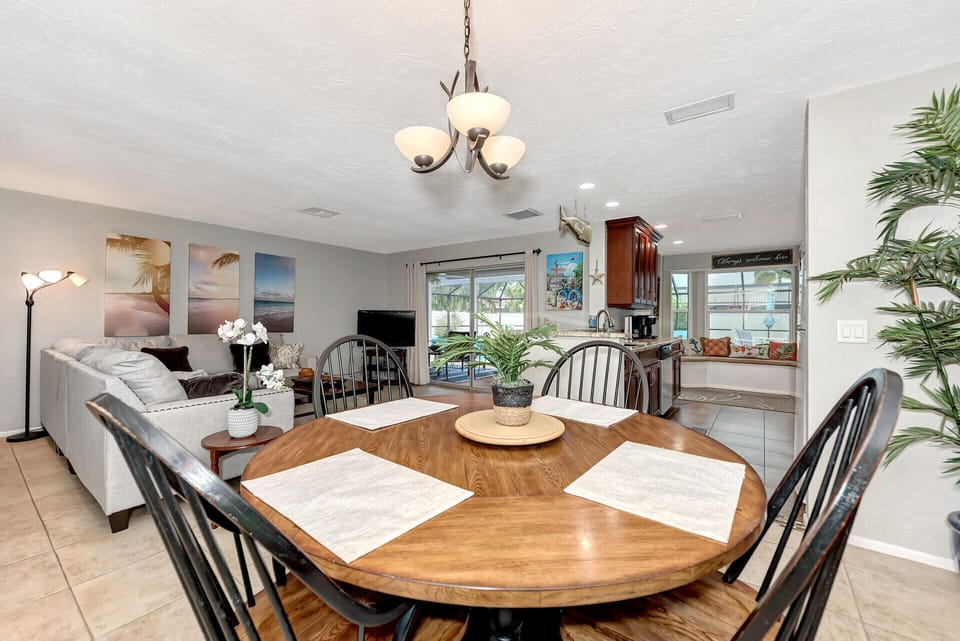 large dining room table with view to the pool area