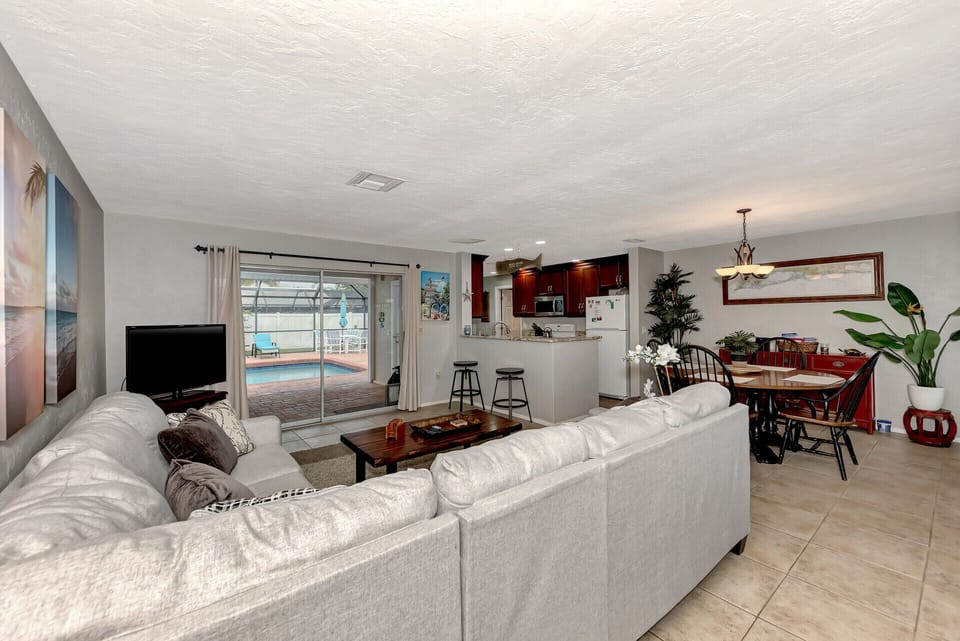 Living room view to the pool.  Sliding glass doors go into the wall 