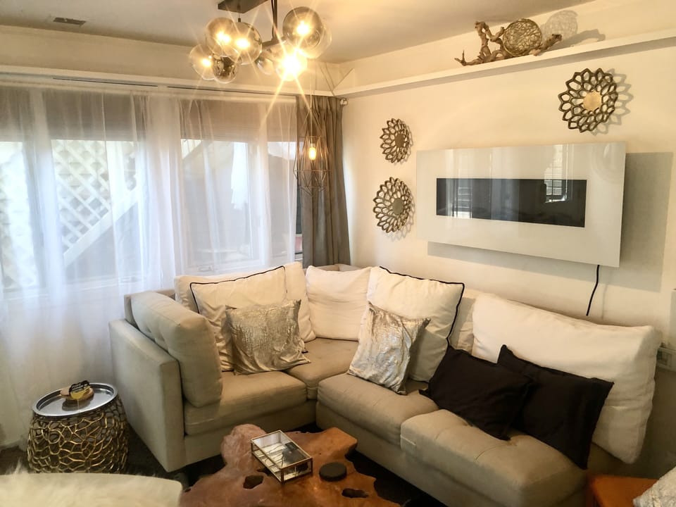 Living room with lots of windows. 