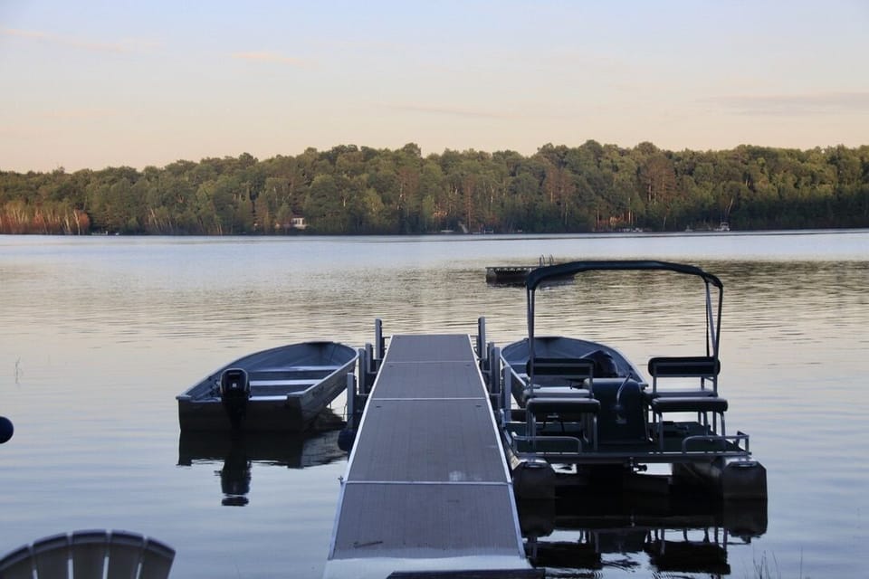 Fishing boat with motor and paddle pontoon boat included with your stay
