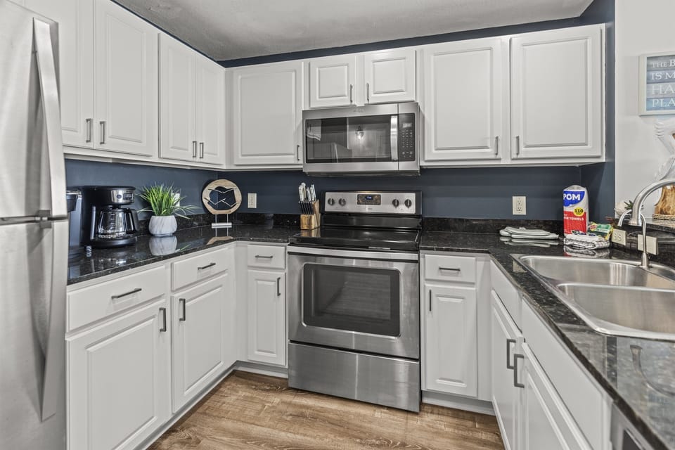 Your fully equipped kitchen features stainless steel appliances and granite countertops, perfect for preparing meals during your stay.