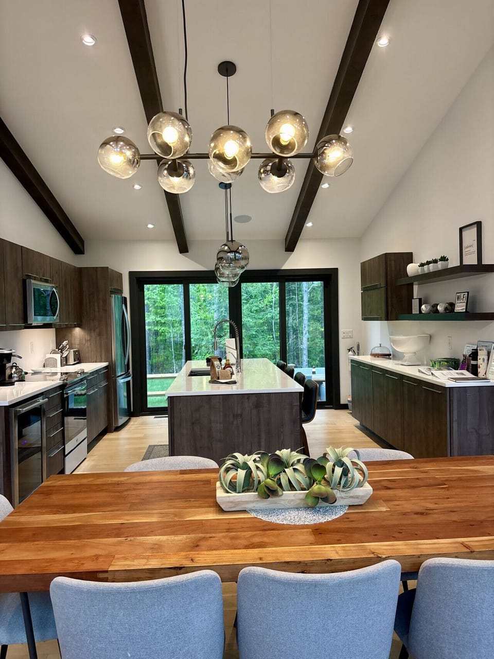The kitchen opens directly to the patio through sliding doors, perfect for easy indoor-outdoor meals, grilling, and keeping an eye on the family while dinner comes together.